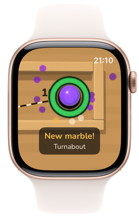 A new marble rises out of the green goal ring on level 2 with confetti