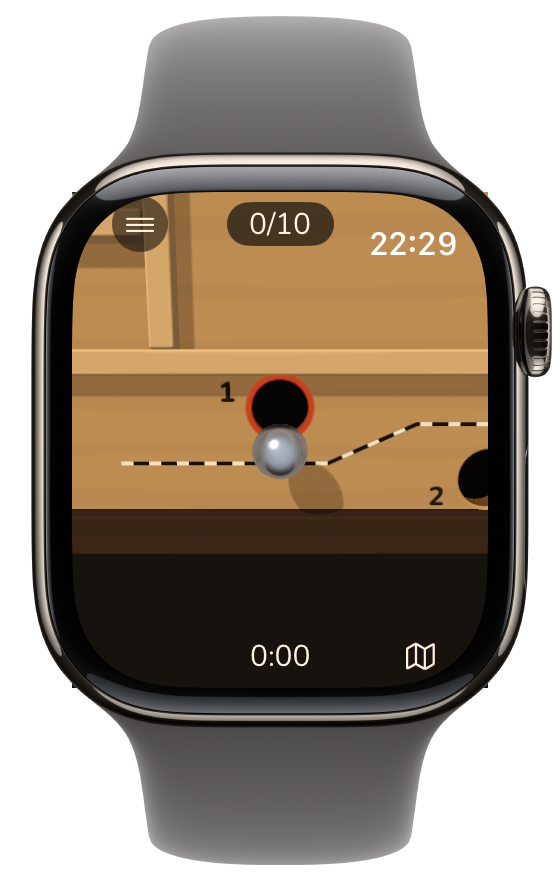 The steel ball teeters on the rim of a hole and a tilt away pulls it back onto the board